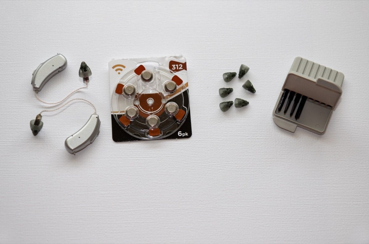 Hearing aid being repaired