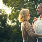 Middle-aged couple dancing outside