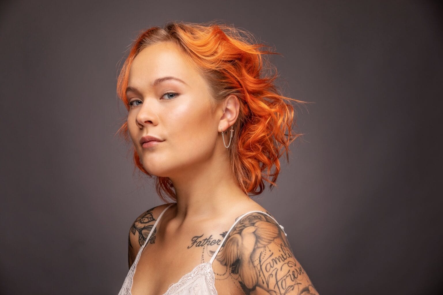 Hearing aid jewelry on younger woman